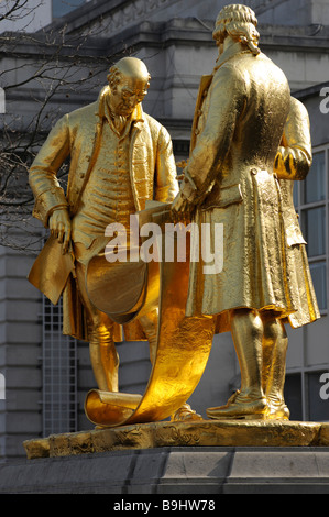 Gilt statue of l to r Matthew Boulton, Watt and Murdock which stands in Broad Street, Birmingham. Full length of Boulton. Stock Photo