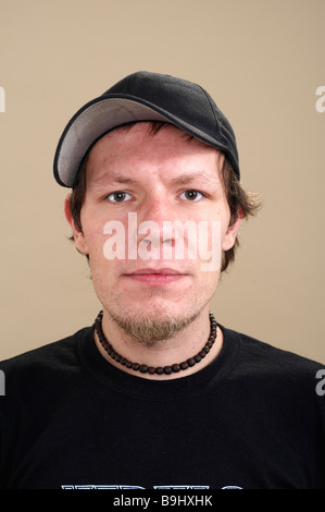 Striking portrait of a young musician wearing a cap Stock Photo