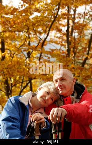 Old-aged couple taking a break from Nordic walking Stock Photo