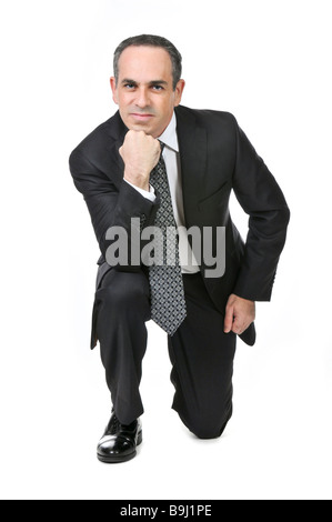 Thinking businessman in a suit isolated on white background Stock Photo