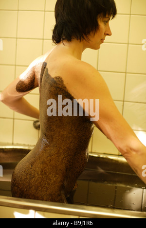 Woman enjoying a mud bath, spa, Frantiskovy Lázně, Bohemia, Czech Republik, Europe Stock Photo