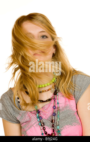 13-year-old with long, blonde hair shaking her head Stock Photo