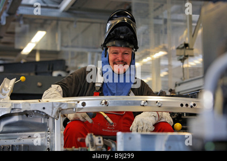 Welder wearing protective mask, Audi R8 construction at the Audi Plant in Neckarsulm, Baden-Wuerttemberg, Germany, Europe Stock Photo