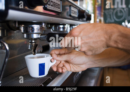 Close up of hands making coffee Stock Photo