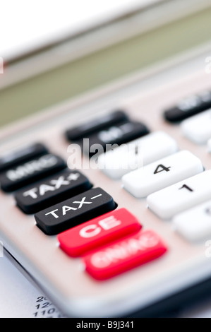 Closeup on tax calculator keypad with red black and white buttons Stock Photo