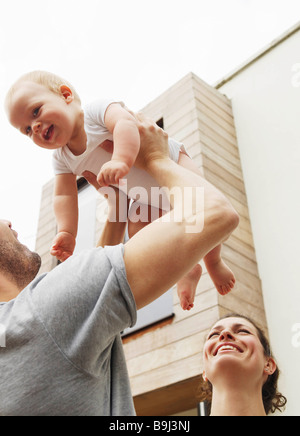 Father holding baby in the air Stock Photo