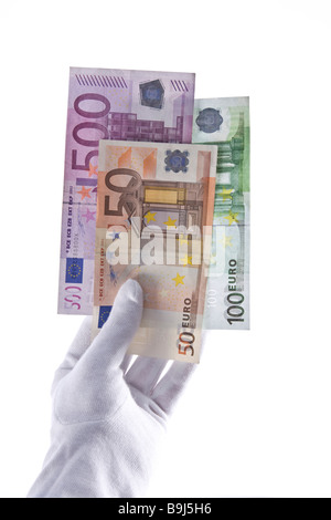 White-gloved hand holding banknotes Stock Photo