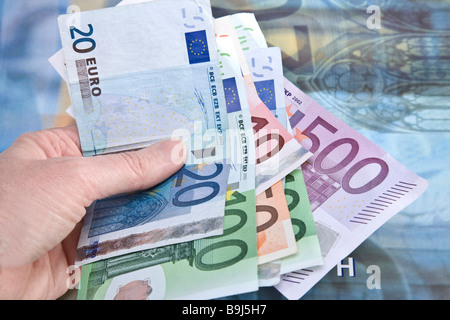 Hand holding banknotes Stock Photo