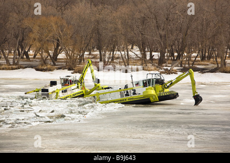 Amphibex Icebreaker machine breaking up ice jams on the Red River, near Selkirk, Manitoba, Canada. Stock Photo