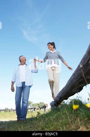 Mature couple holding hands Stock Photo