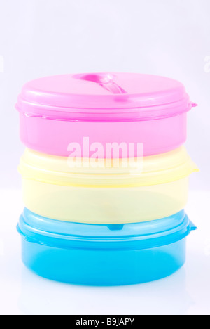 Stack of empty plastic lunch boxes cutout against a white background Stock Photo
