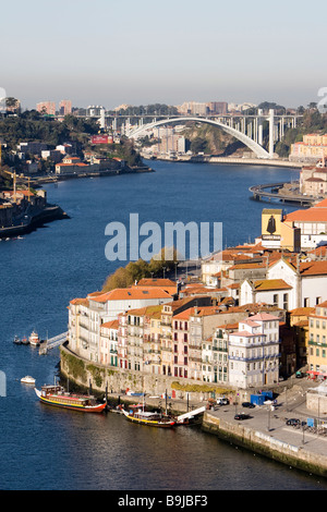 View of the historic centre of Porto with the Rio Duoro River from the Vila Nova de Gaia quarter, at back the Ponte de Arrábida Stock Photo