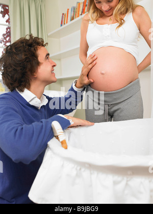 Couple in nursery Stock Photo