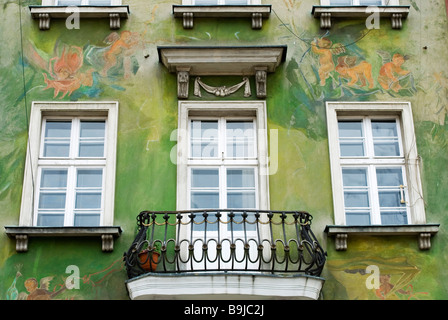 The green painted exterior of a house in the Old Market Square, Poznan, Poland Stock Photo