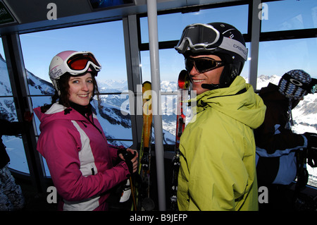 Group of skiers in ski lift to Scex Rouge, Col du Pillon, skiing region Glacier 3000, Gstaad, Western Alps, Bernese Oberland, S Stock Photo