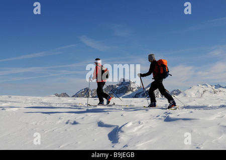 Ski alpinists on Parwengsattel, Sankt Stephan, Zweisimmen, Saanenland, Western Alps, Bernese Oberland, Switzerland, Europe Stock Photo