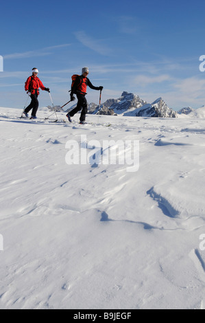 Ski alpinists on Parwengsattel, Sankt Stephan, Zweisimmen, Saanenland, Western Alps, Bernese Oberland, Switzerland, Europe Stock Photo