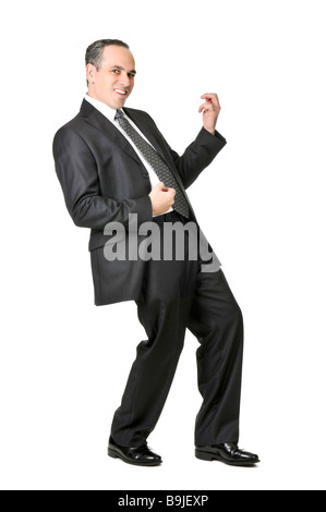 Happy businessman in a suit playing an air guitar isolated on white background Stock Photo