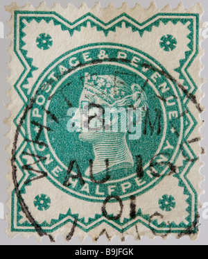 Close up of ½d, one half penny green Victorian British Postal stamp on black background issued between 1887-1900, part of the 'Jubilee Issue'. Used. Stock Photo