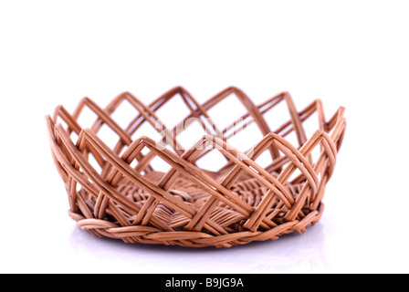Empty wicker basket against a white background Stock Photo