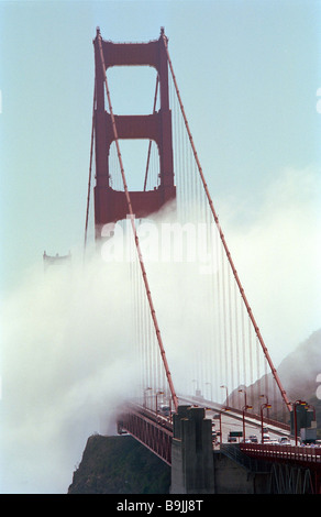 Sea fog rolls over the Golden Gate Bridge in San Francisco California Stock Photo