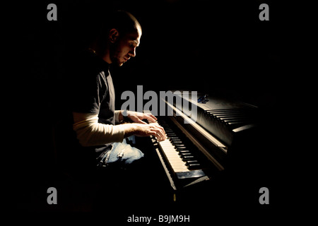 Pianist playing on electric piano Stock Photo