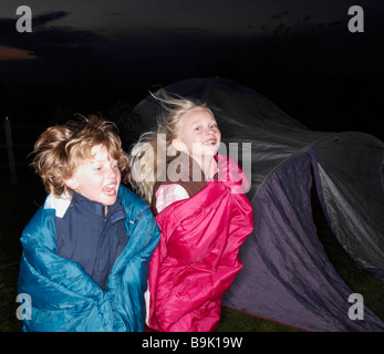 Sleeping bag races at dusk Stock Photo