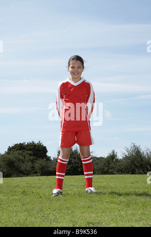 Female footballer standing Stock Photo