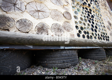 Cord wood wall,sustainable building Stock Photo