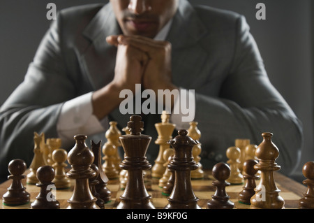 Indian businessman playing chess Stock Photo
