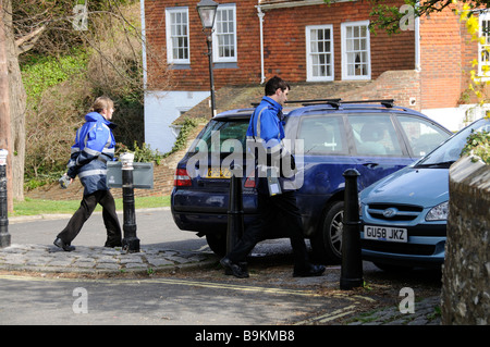 Traffic wardens patrolling a residential street in Lewes East Sussex southern England UK Stock Photo