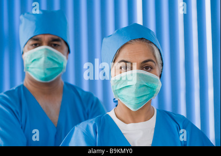 Portrait of surgeons wearing surgical masks Stock Photo