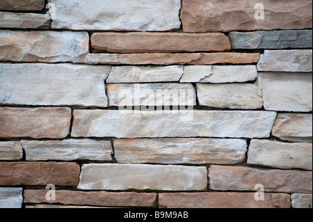 A wall of pale sandstone bricks good for a texture Stock Photo