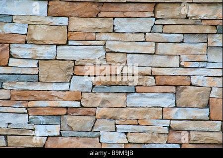 A wall of pale sandstone bricks good for a texture Stock Photo