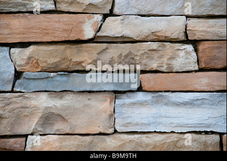 A wall of pale sandstone bricks good for a texture Stock Photo