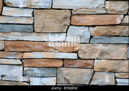 A wall of pale sandstone bricks good for a texture Stock Photo