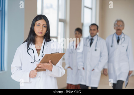 Four doctors standing in a hospital Stock Photo
