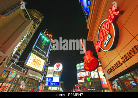 Eaton Centre, Hard Rock Cafe and Yonge Dundas Square seen along Yonge Street in downtown Toronto at night Ontario Canada Stock Photo