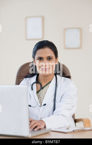 Female doctor using a laptop Stock Photo