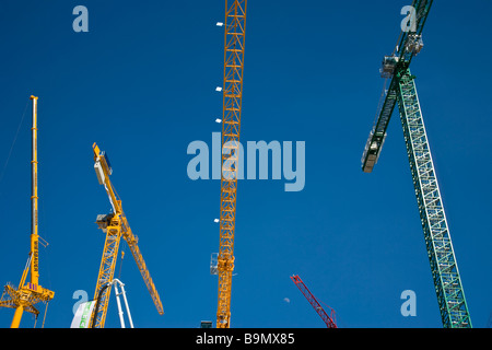 Cranes reaching towards the sky Stock Photo