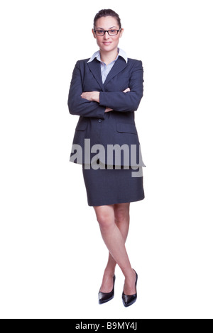 Full length portrait of a smiling businesswoman wearing a skirted suit isolated on white background Stock Photo