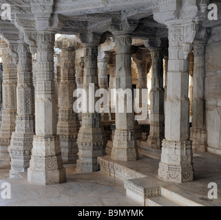 Intricately carved marble stonework and columns at  Chaumukha Temple the main temple in the complex of Jain temples at Ranakpur. Stock Photo