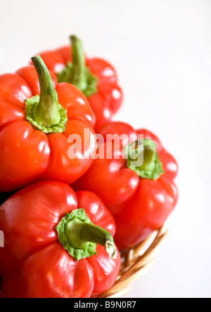 Group of red peppers on white Stock Photo