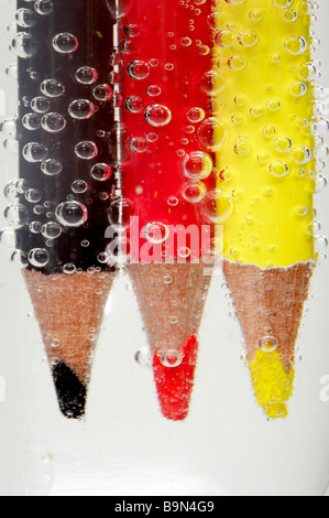 coloured pencil in sparkling water Stock Photo