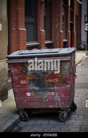 Old dumpster in Manchester city centre UK Stock Photo