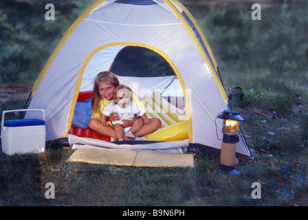 Outdoor Babysitting while tent camping Stock Photo
