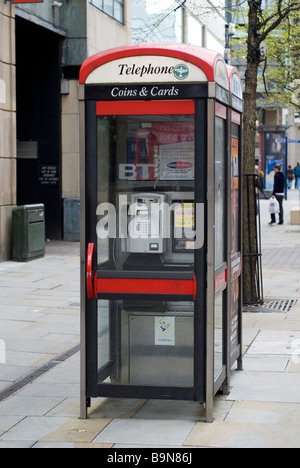 Modern telephone booth in Manchester city centre UK Stock Photo