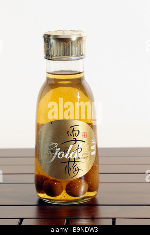 A bottle of Korean alcoholic drink Seoljungmae Gold (made of plum) with real gold powder dust inside. Stock Photo