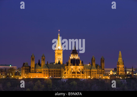 View of Parliament Hill seen from Nepean Point at dusk in the city of Ottawa Ontario Canada Stock Photo