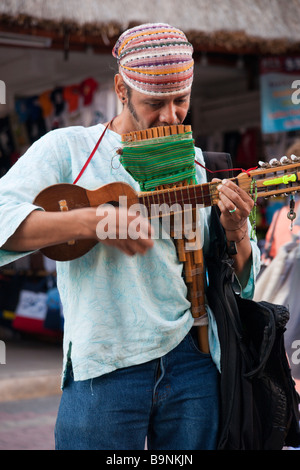 Mexico Yucatan - Playa del Carmen, a Peruvian trovadore busker with charango stringed instrument and pan pipes Stock Photo